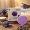 Glowtic Lavender Soap lifestyle image with lavender flowers and candle for relaxation, calming bath and stress relief.